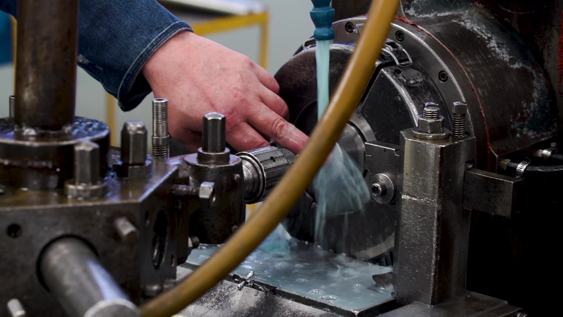 Coolant flowing over a turned part on the lathe