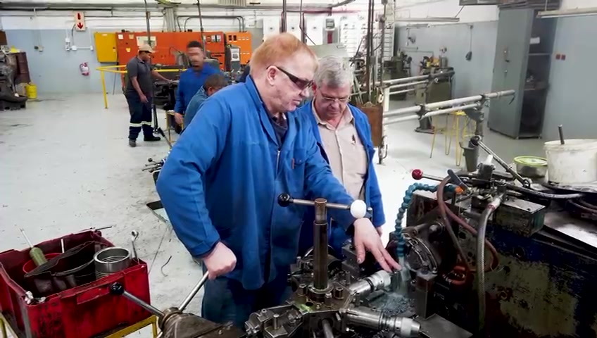 Artisans at work across the machine shop floor